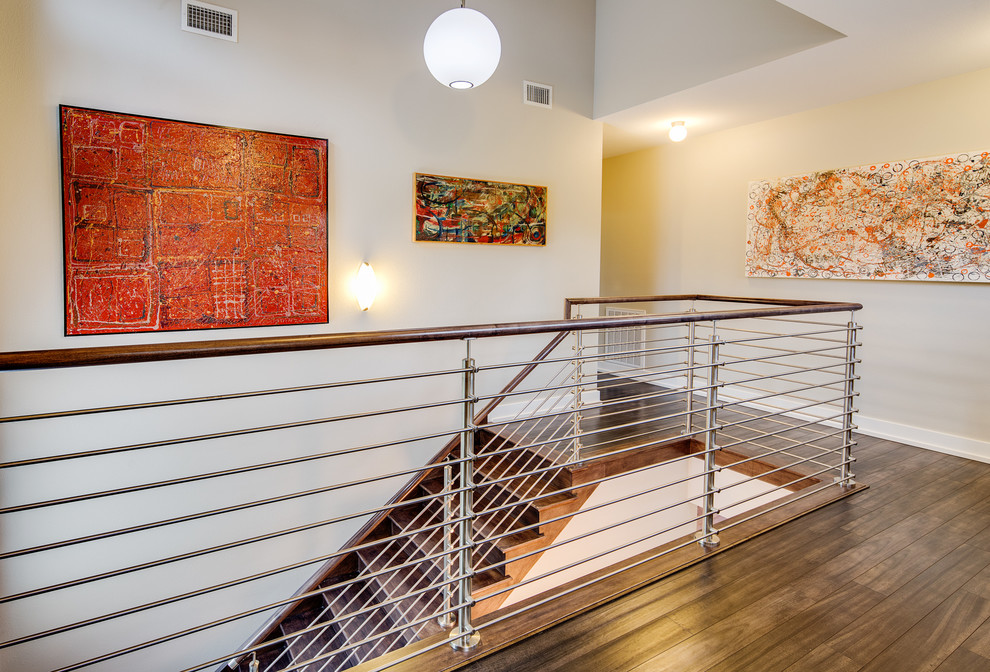 Inspiration for a mid-sized modern wooden l-shaped staircase remodel in Austin with wooden risers