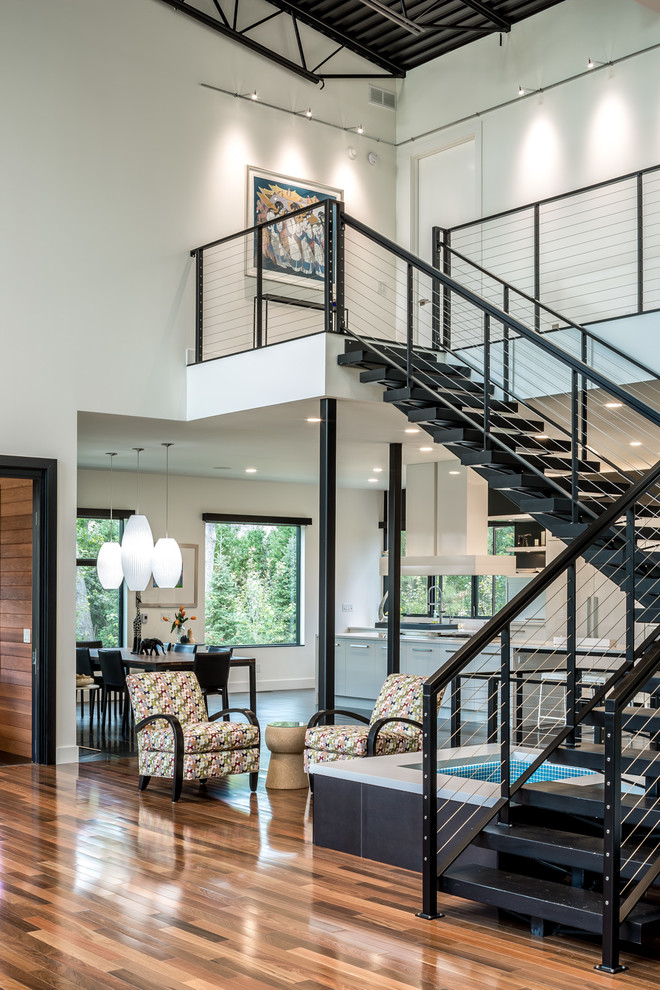 Expansive contemporary metal floating staircase in Minneapolis with open risers.