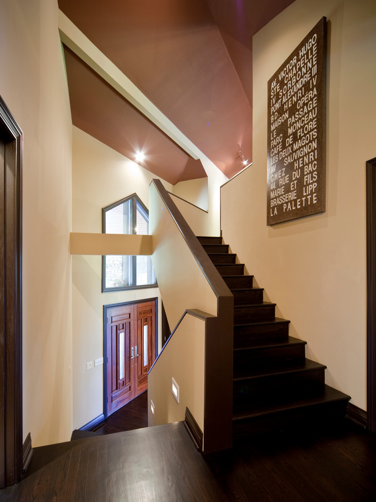 Contemporary wood u-shaped staircase in Kansas City with wood risers.