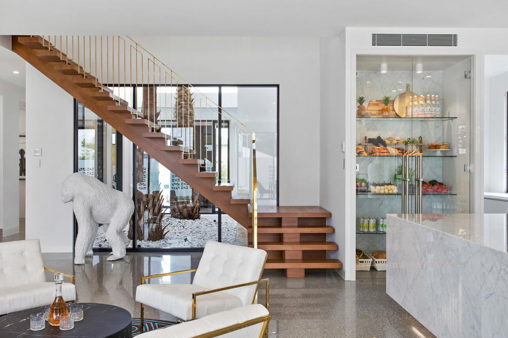 Источник вдохновения для домашнего уюта: угловая лестница в стиле ретро с деревянными ступенями и металлическими перилами