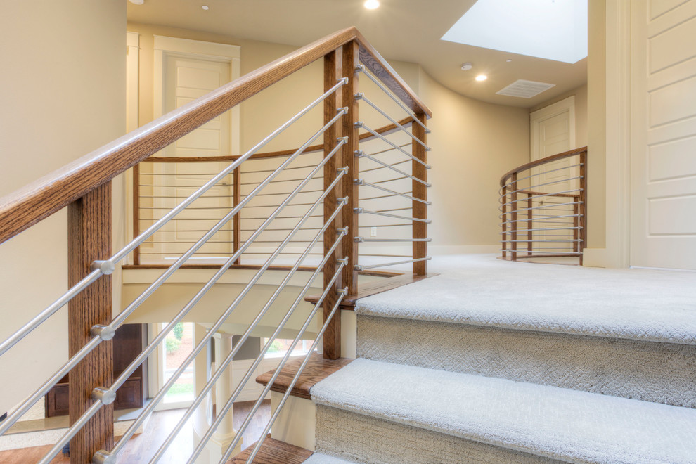 Inspiration for a medium sized modern carpeted curved staircase in Seattle with carpeted risers.