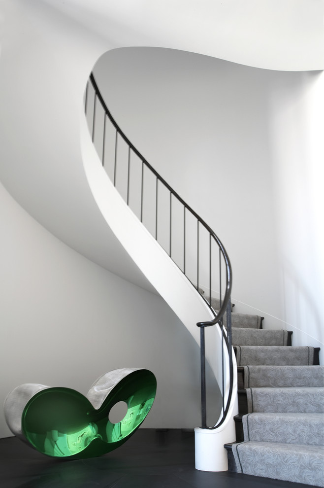 Photo of a modern wood curved staircase in San Francisco with wood risers.