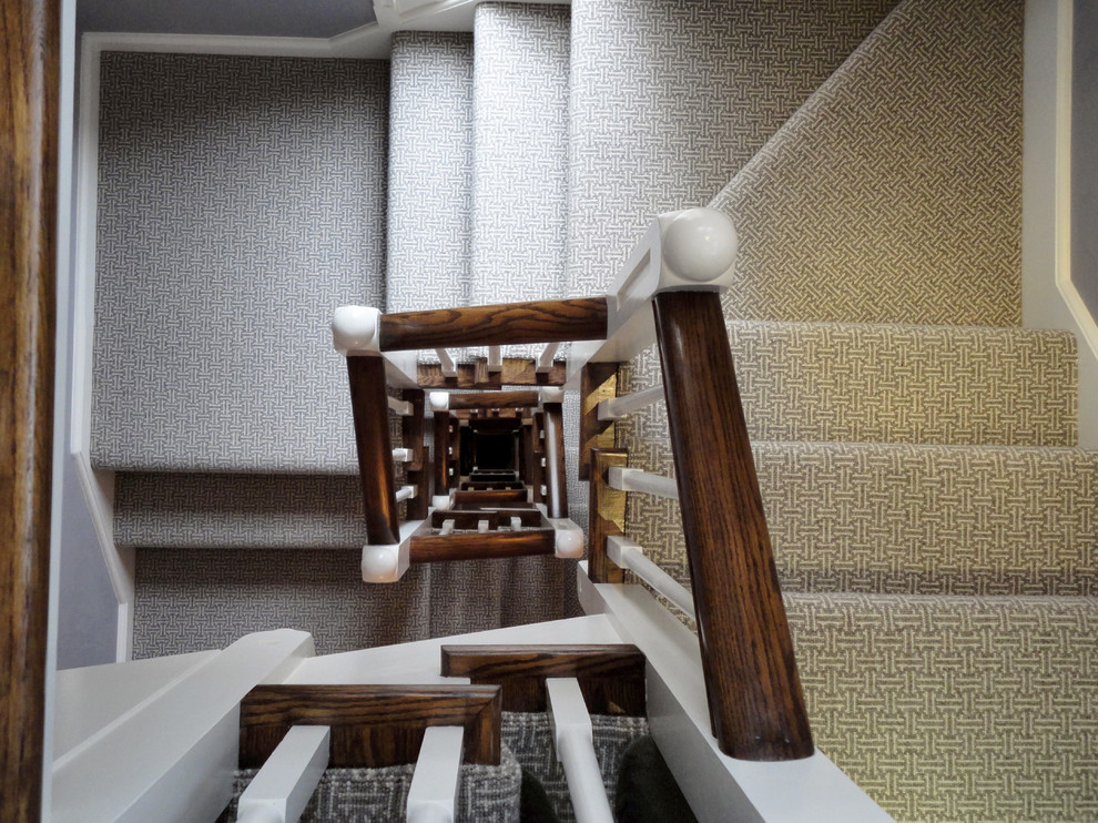 Large minimalist carpeted l-shaped staircase photo in Chicago with carpeted risers