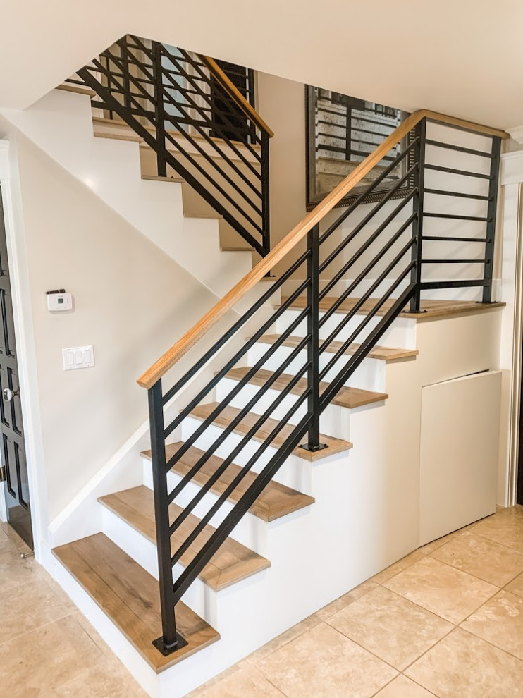 Inspiration for a medium sized traditional wood u-shaped wood railing staircase in Los Angeles with wood risers.