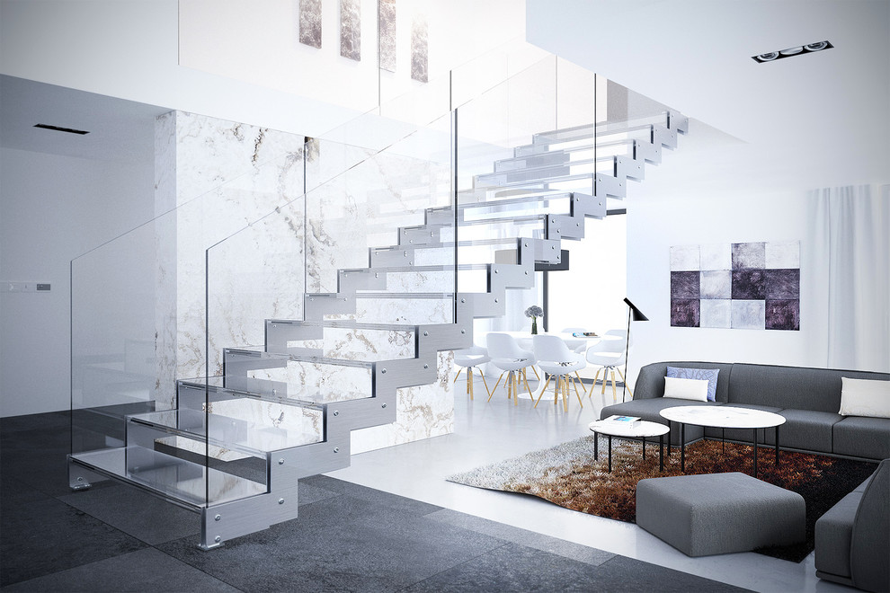 Cette image montre un grand escalier sans contremarche flottant design avec des marches en verre, un garde-corps en verre et éclairage.
