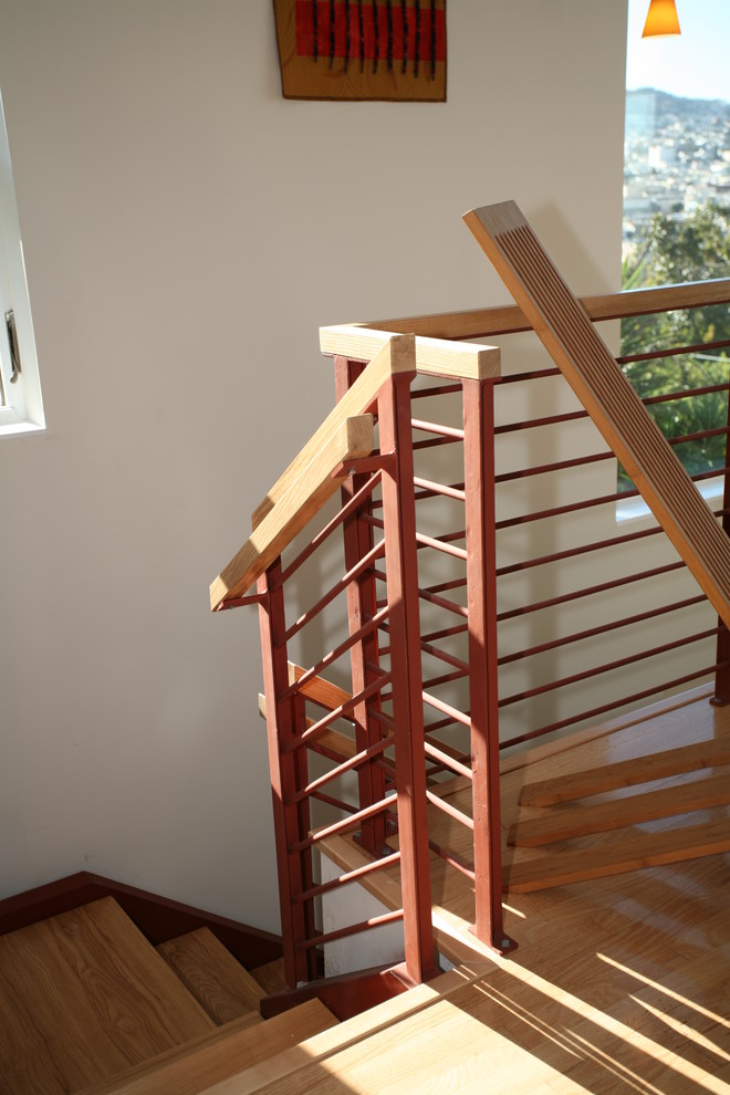 Ejemplo de escalera contemporánea con escalones de madera