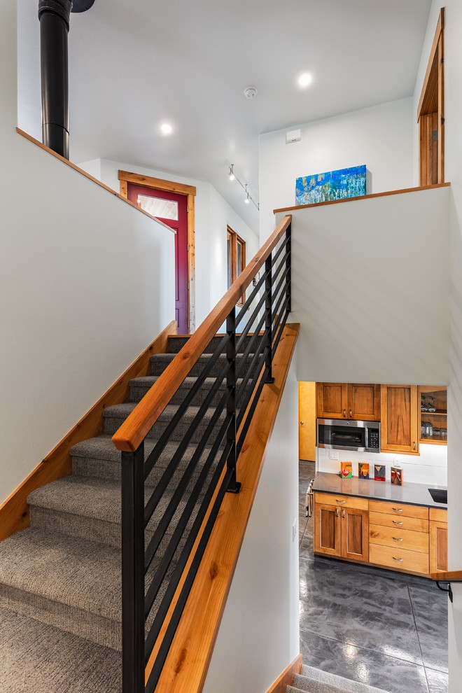 Staircase - mid-sized modern carpeted u-shaped staircase idea in Denver with carpeted risers