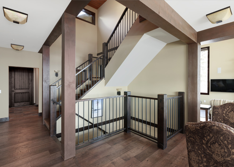 Design ideas for a rustic wood railing staircase in Vancouver with wood risers.