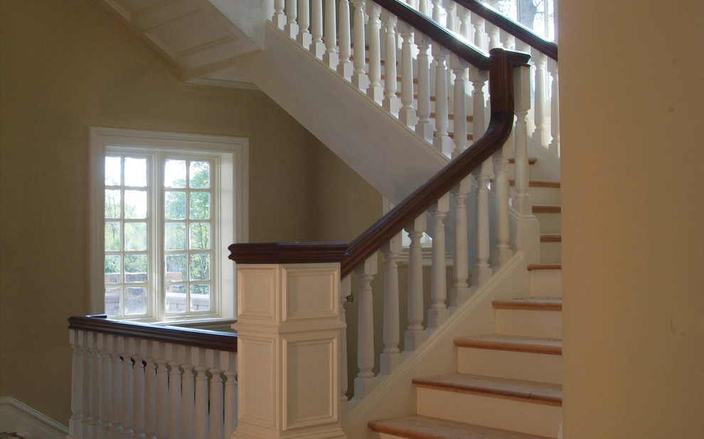 Example of a mid-sized classic wooden l-shaped wood railing staircase design in Charlotte with wooden risers
