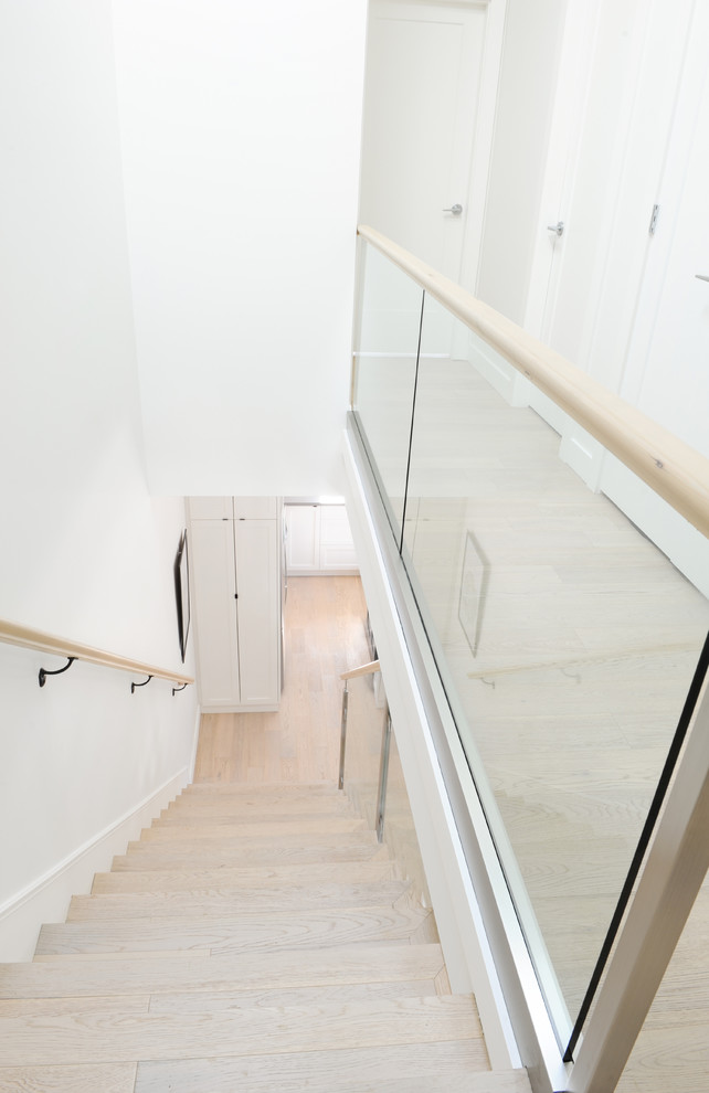 Example of a trendy wooden straight staircase design in Vancouver