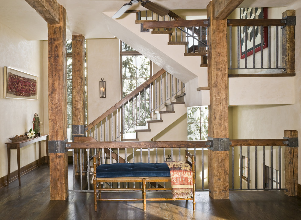 Rustic metal railing staircase in Other.