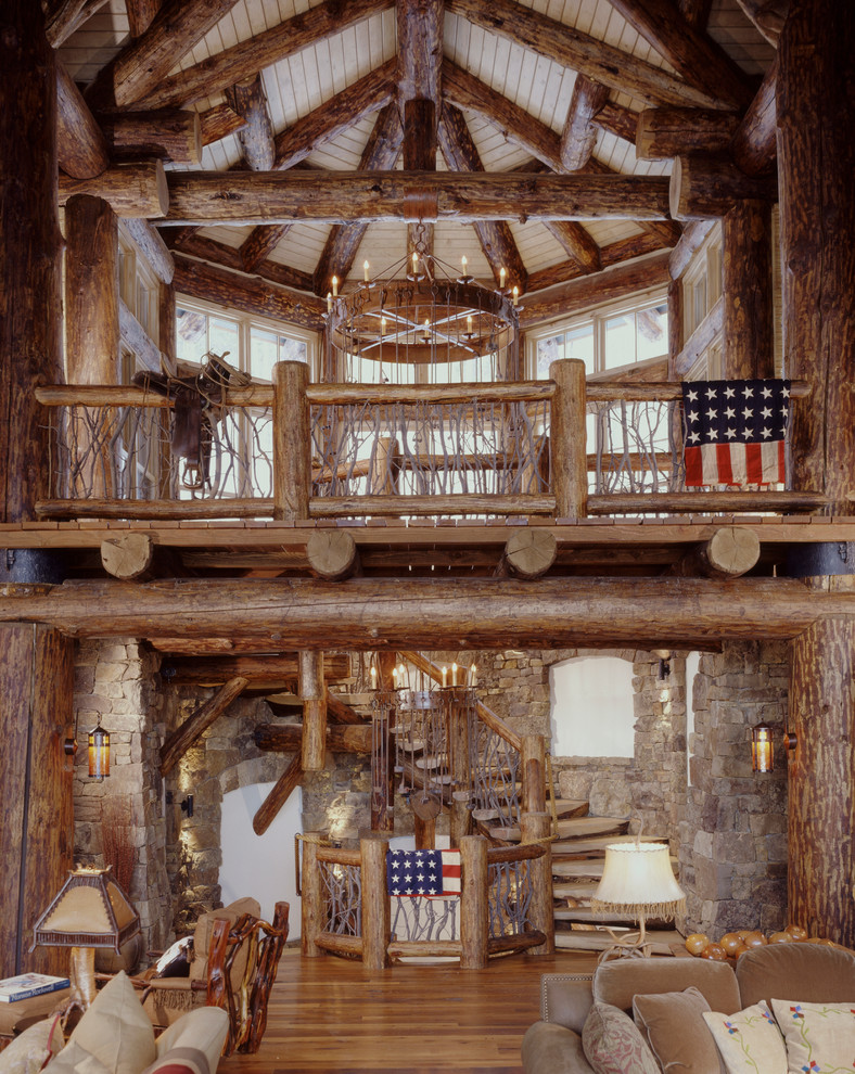 Inspiration for a rustic spiral staircase in Denver with feature lighting.