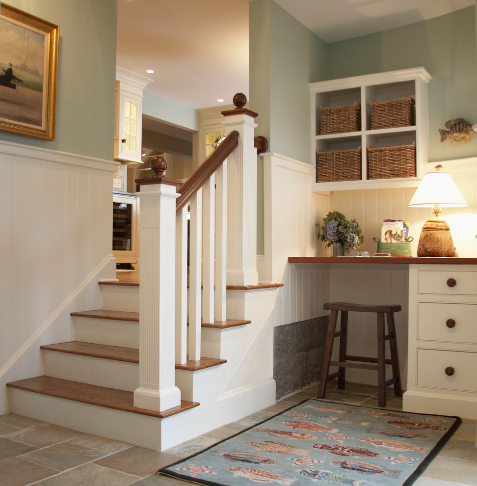 Photo of a beach style wood staircase in Boston with painted wood risers and feature lighting.
