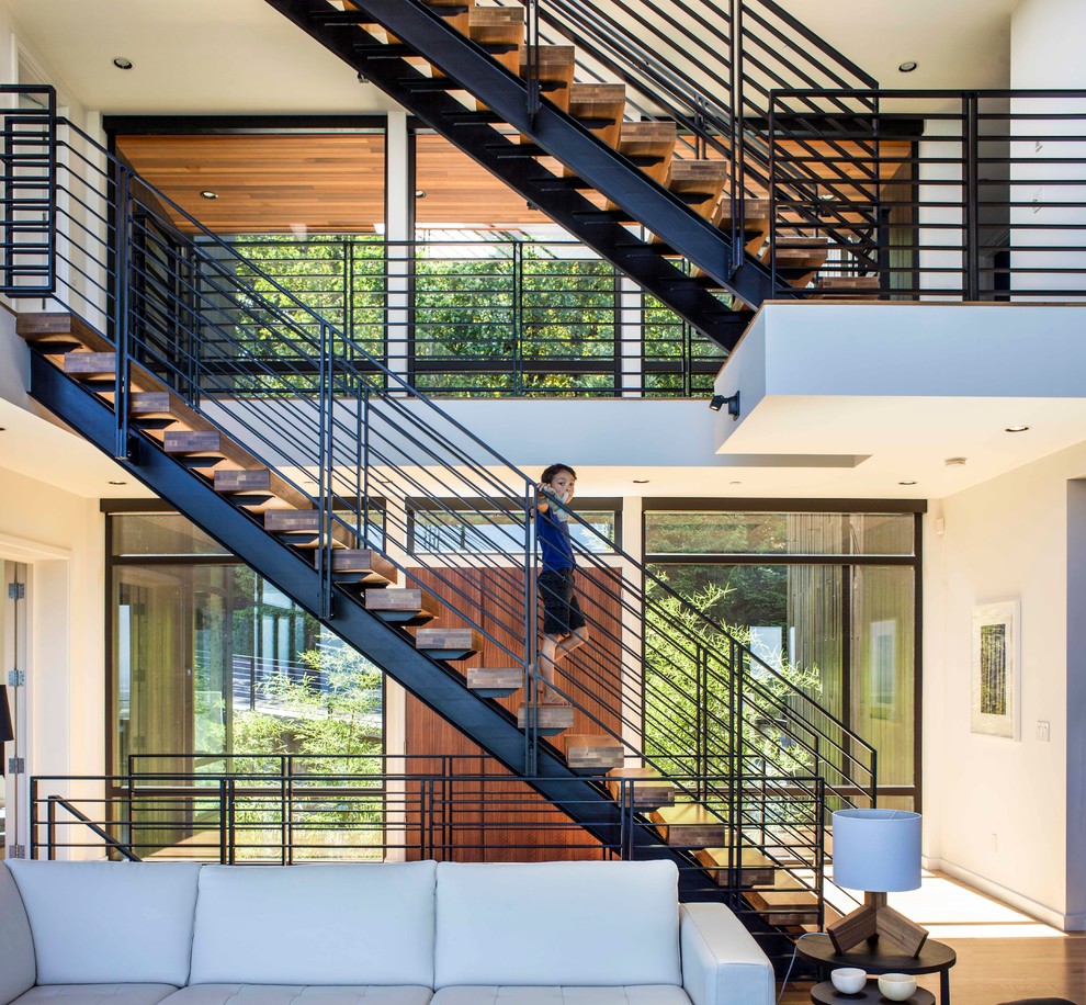 Contemporary staircase in Portland with feature lighting.