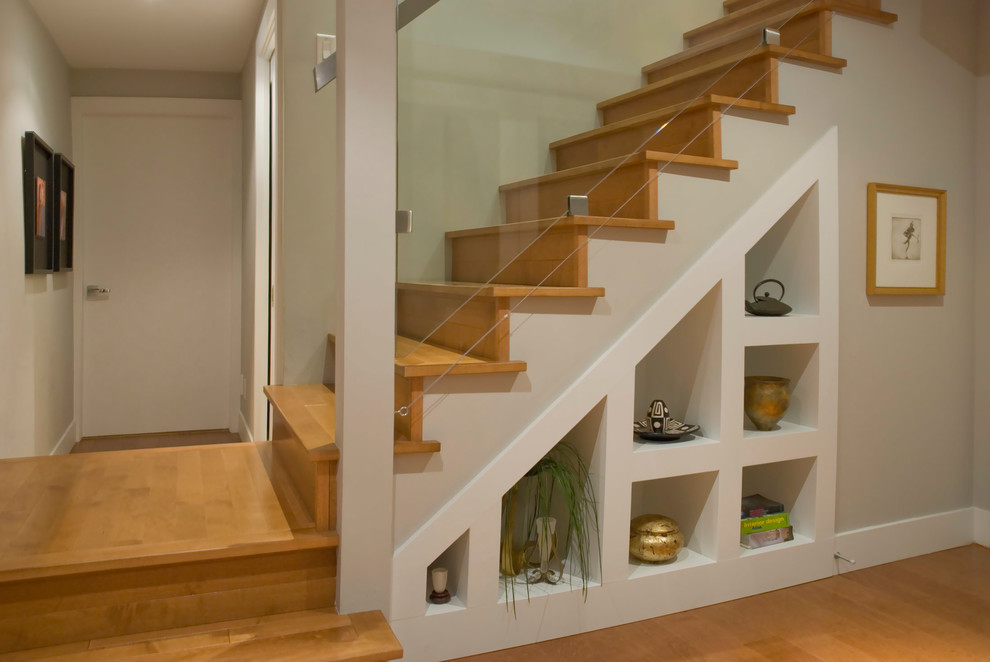 Inspiration for a contemporary staircase in Vancouver with under stair storage.