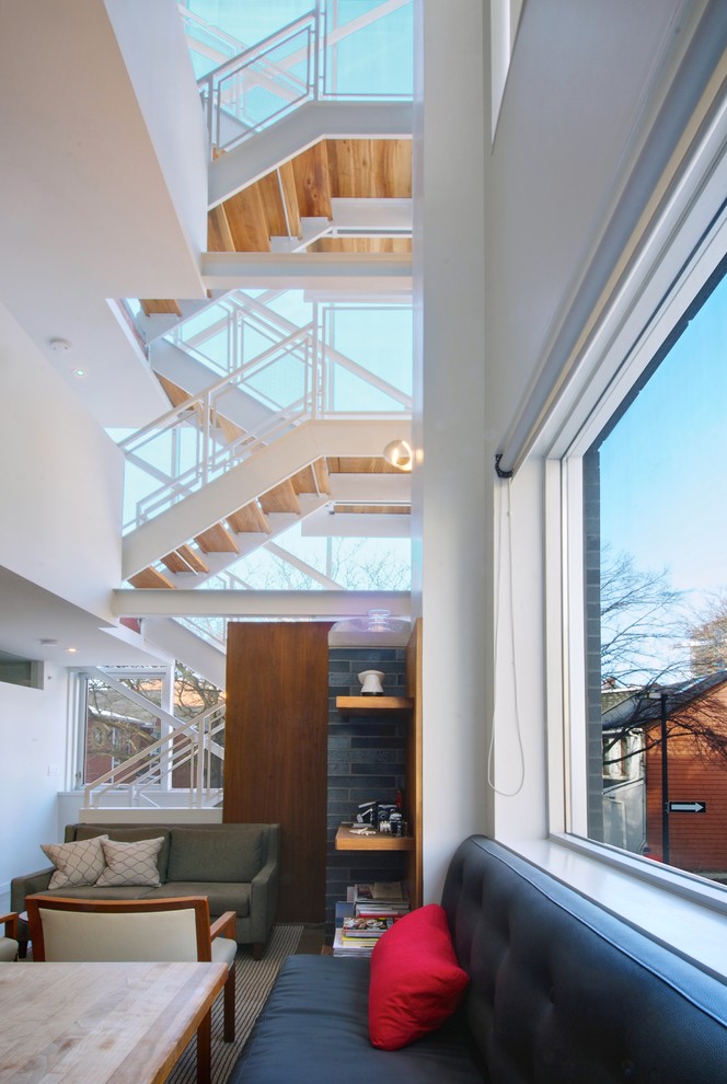 Contemporary staircase in Toronto with open risers.