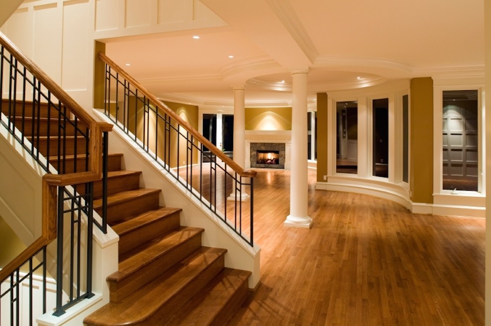 Example of a mid-sized transitional wooden u-shaped staircase design in San Diego with wooden risers