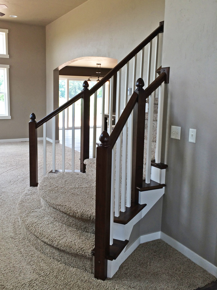 Inspiration for a medium sized classic carpeted curved staircase in Milwaukee with carpeted risers.