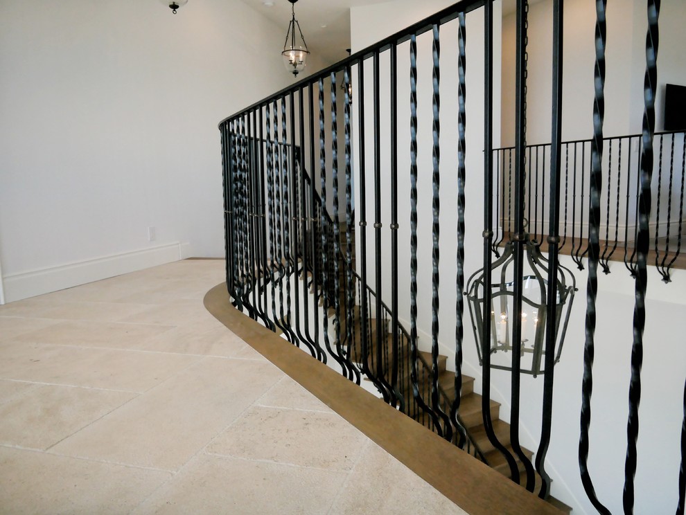 Example of an arts and crafts staircase design in Orange County