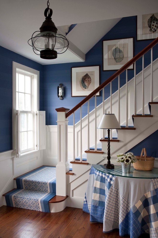 Inspiration for a mid-sized timeless wooden l-shaped staircase remodel in Boston with painted risers