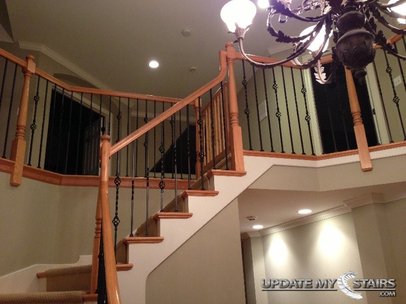 This is an example of a traditional wood curved staircase in Chicago with wood risers.