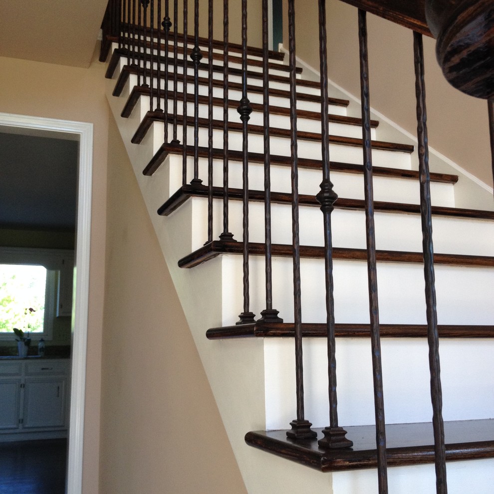 Example of a trendy wooden straight staircase design in Chicago with wooden risers