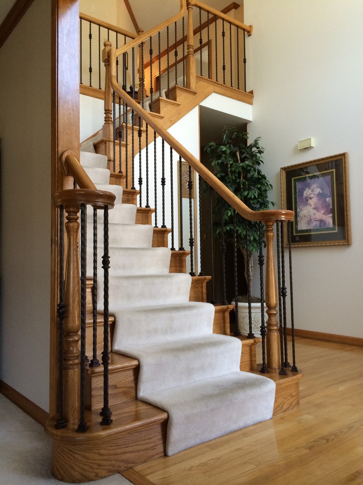 Staircase - traditional wooden l-shaped staircase idea in Chicago with wooden risers