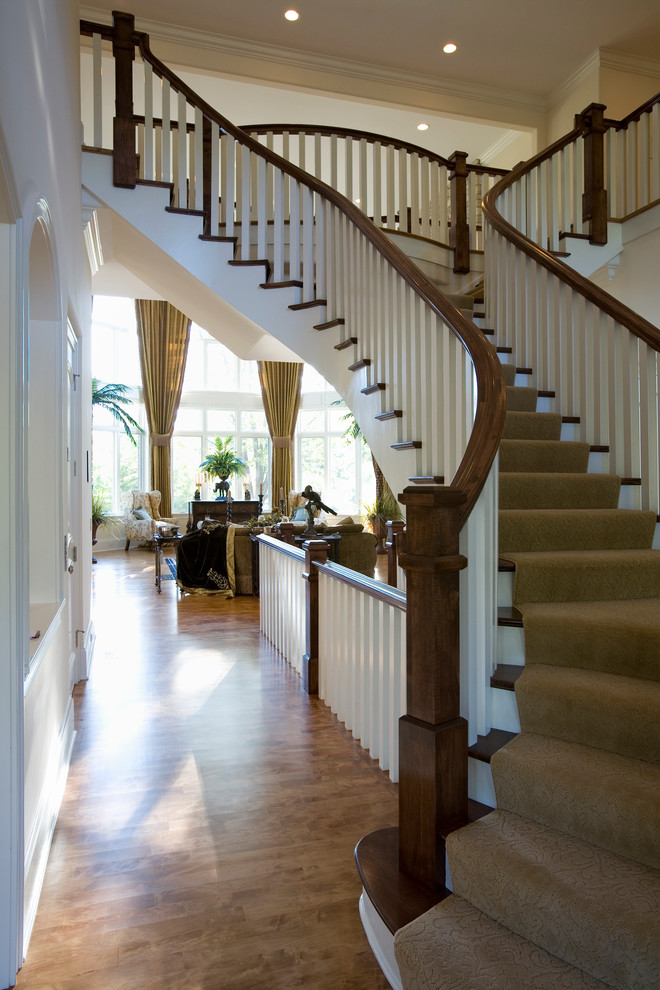 Expansive eclectic carpeted staircase in Chicago with carpeted risers.