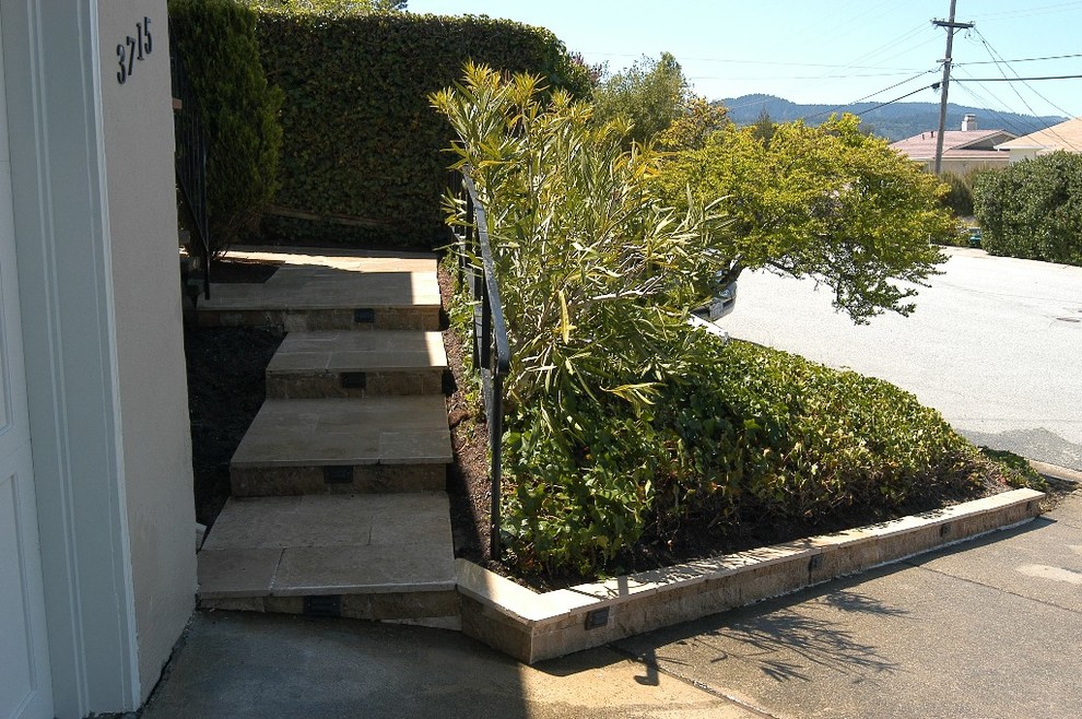 Photo of a medium sized contemporary l-shaped staircase in San Francisco.