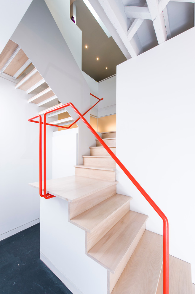 Inspiration for an industrial wood l-shaped staircase in DC Metro with wood risers.