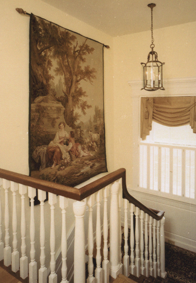 Photo of a medium sized classic staircase in Philadelphia with wood risers.
