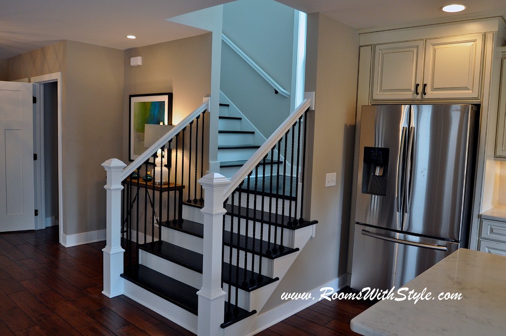 Photo of a medium sized modern wood l-shaped staircase in Minneapolis with wood risers.