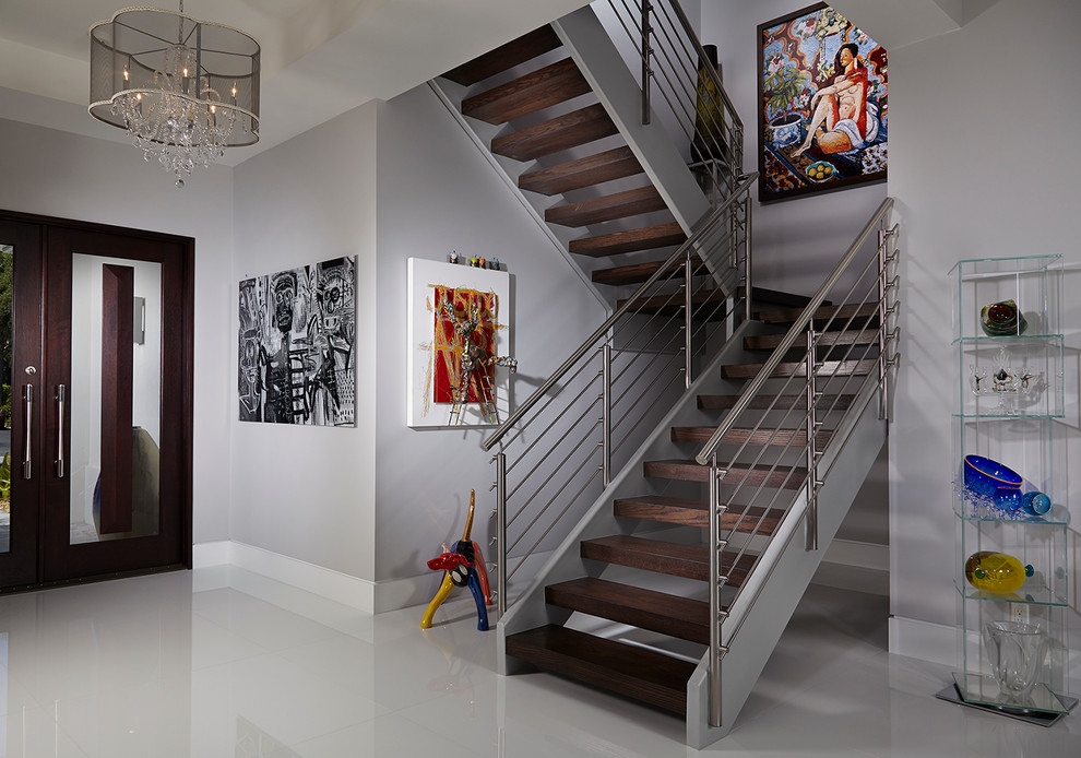 Example of a trendy wooden u-shaped open staircase design in Miami