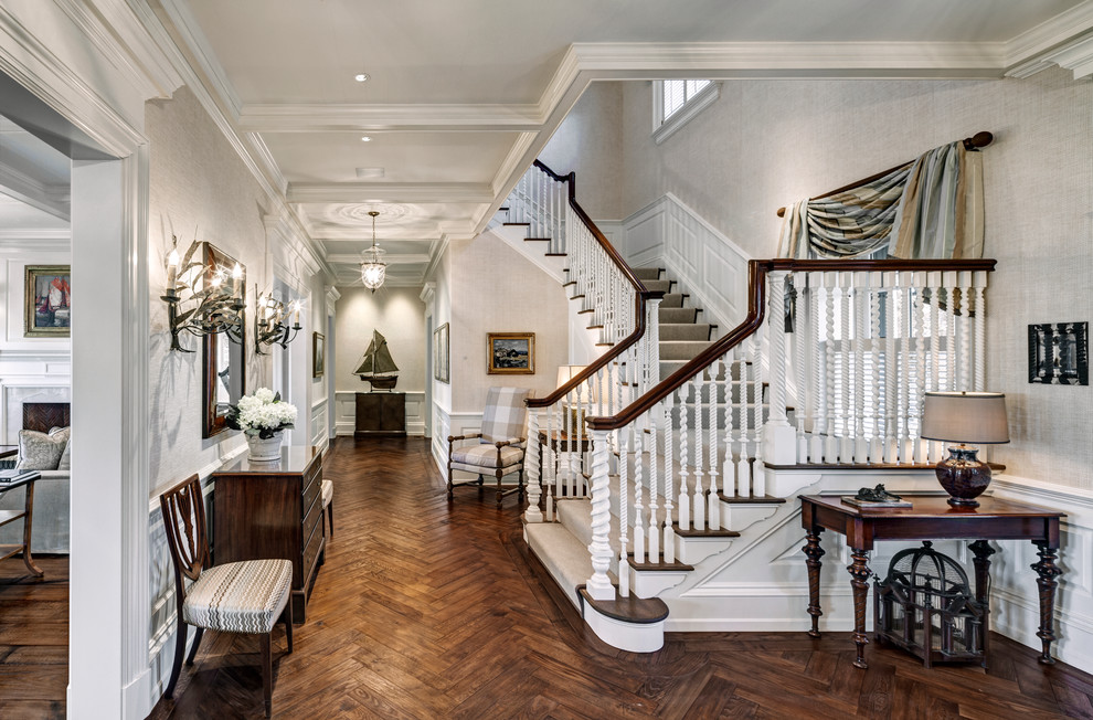 Example of a transitional wooden u-shaped staircase design in New York with wooden risers