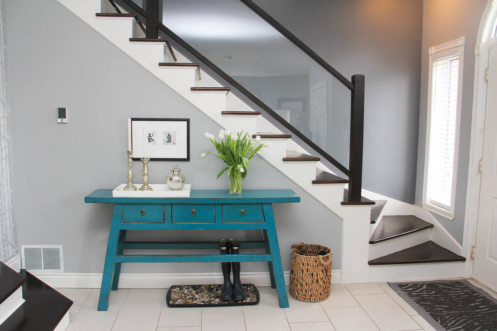 Inspiration for a transitional wooden staircase remodel in Other