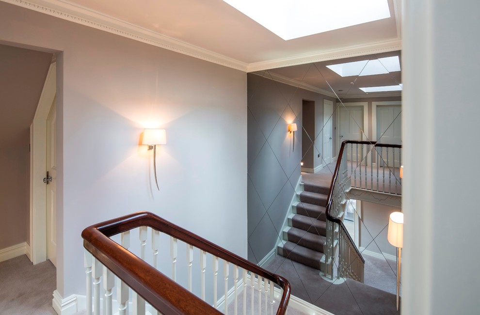 Classic staircase in London with feature lighting.
