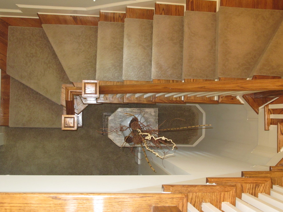 Example of an eclectic staircase design in Atlanta