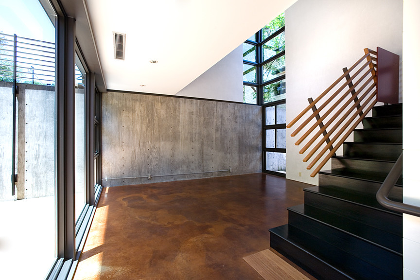 Inspiration for a large industrial straight staircase remodel in Austin