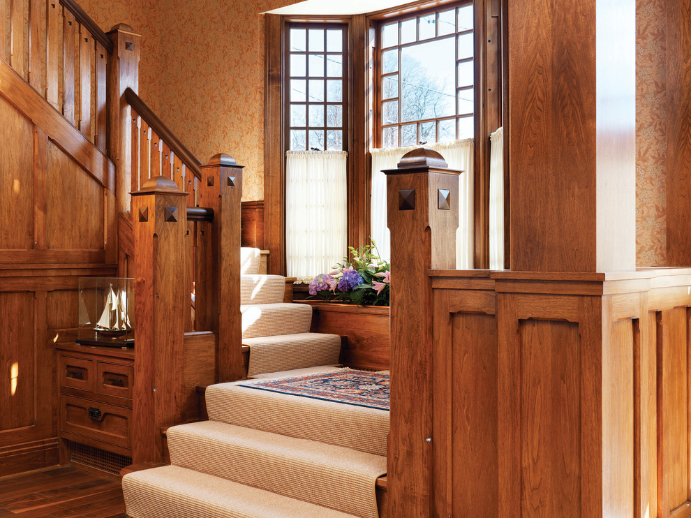 Medium sized traditional wood u-shaped staircase in Providence with wood risers.