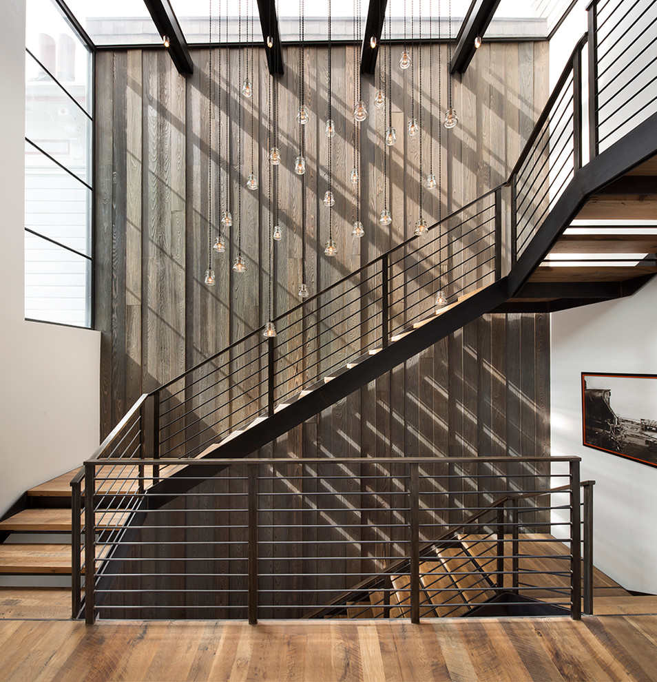 Diseño de escalera en U contemporánea sin contrahuella con escalones de madera