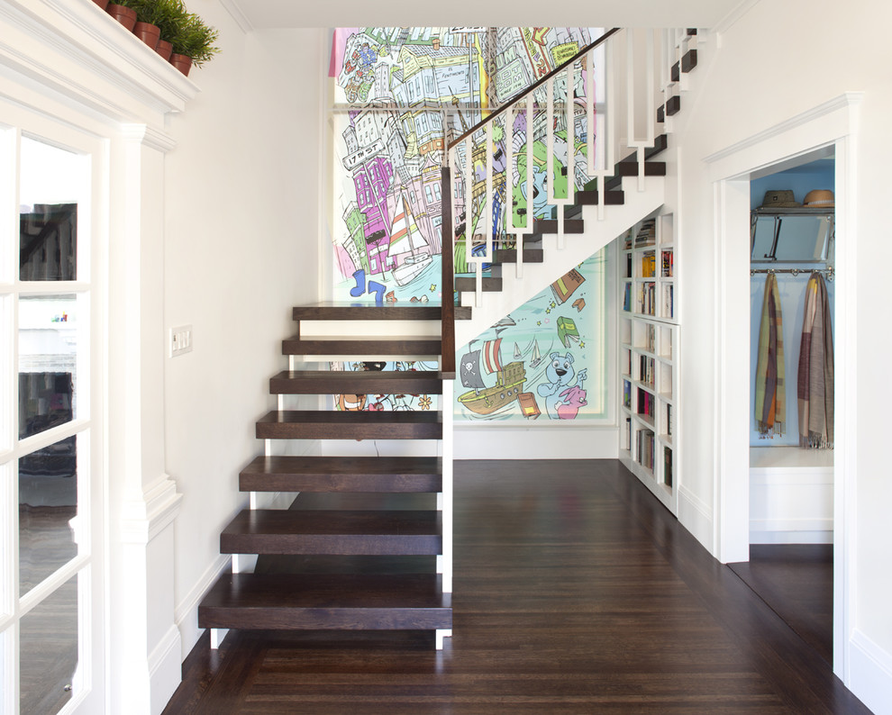 Cette image montre un escalier sans contremarche design en L avec des marches en bois et un garde-corps en matériaux mixtes.