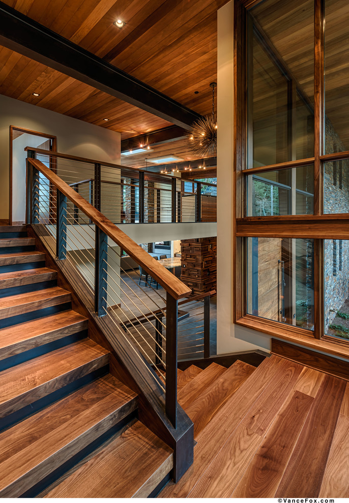 Inspiration for a mid-sized contemporary wooden l-shaped staircase remodel in Sacramento with wooden risers