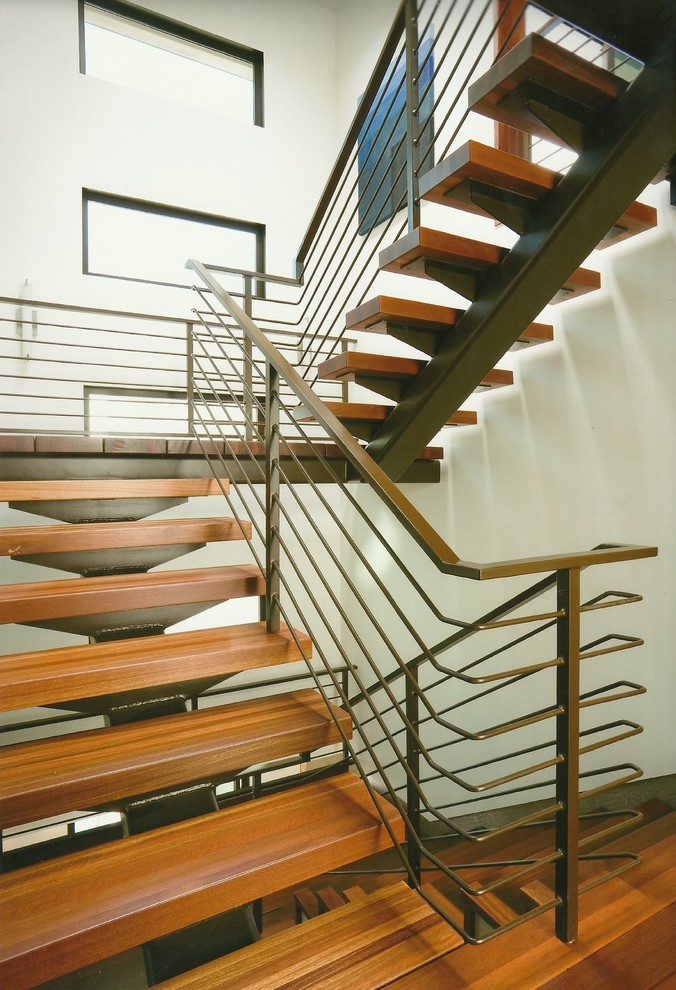 Inspiration for a large coastal wooden u-shaped open staircase remodel in Los Angeles