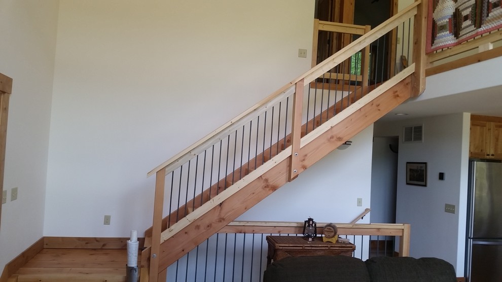 Источник вдохновения для домашнего уюта: угловая деревянная лестница среднего размера в стиле рустика с деревянными ступенями и деревянными перилами