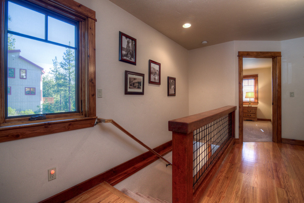Mid-sized arts and crafts tile straight wood railing staircase photo in Sacramento with tile risers