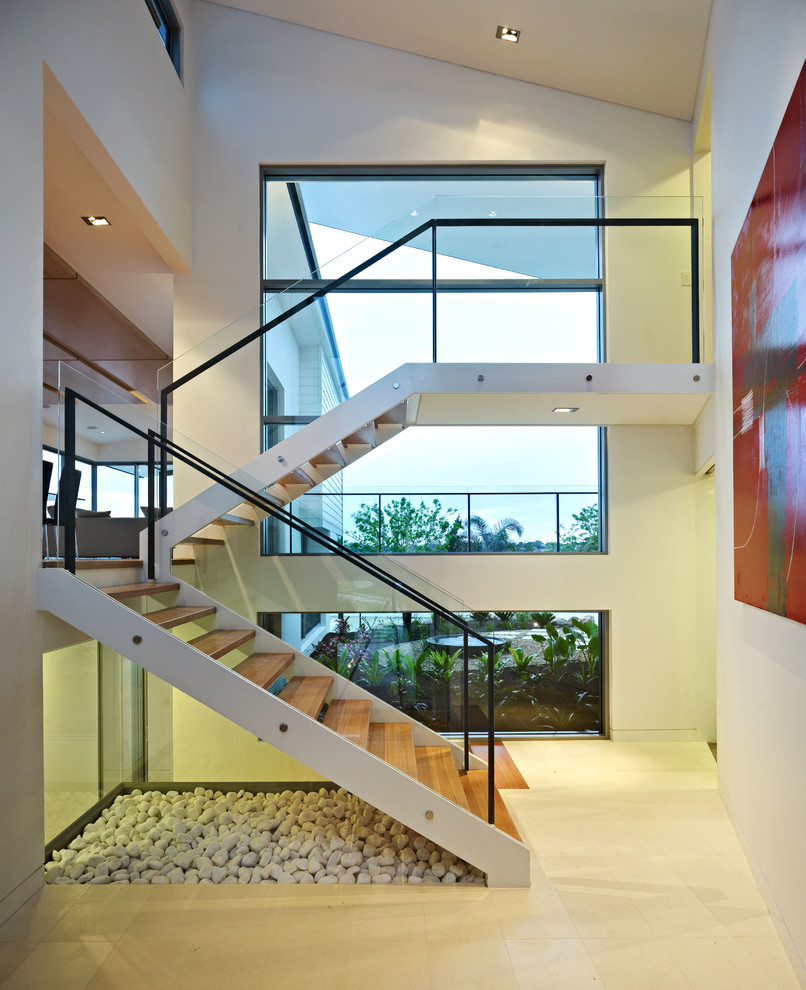 Diseño de escalera recta contemporánea sin contrahuella con escalones de madera