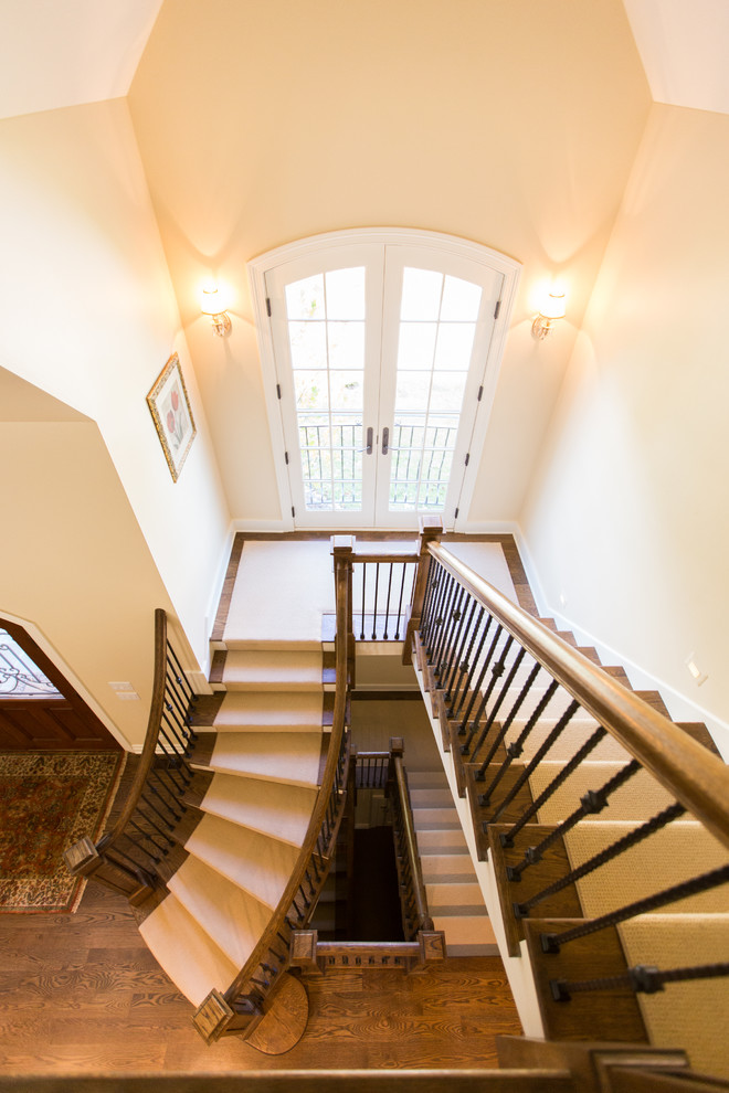 Example of a mid-sized classic wooden u-shaped staircase design in Chicago with painted risers