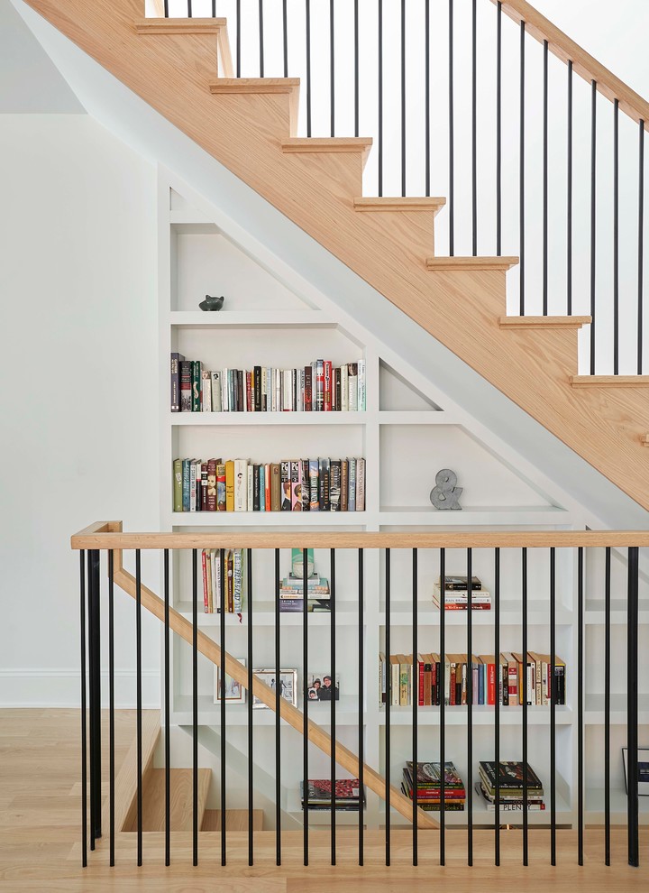 Medium sized traditional wood straight metal railing staircase in Chicago with wood risers.