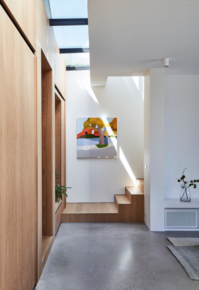Example of a trendy wooden straight staircase design in Melbourne with wooden risers