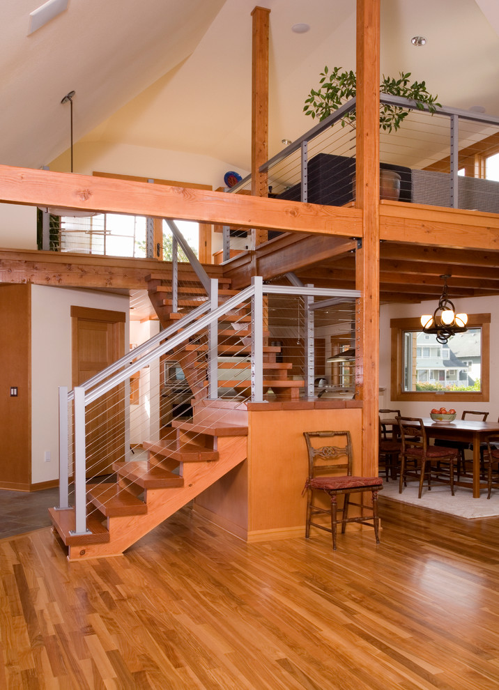 Staircase - contemporary wooden l-shaped staircase idea in Seattle with wooden risers